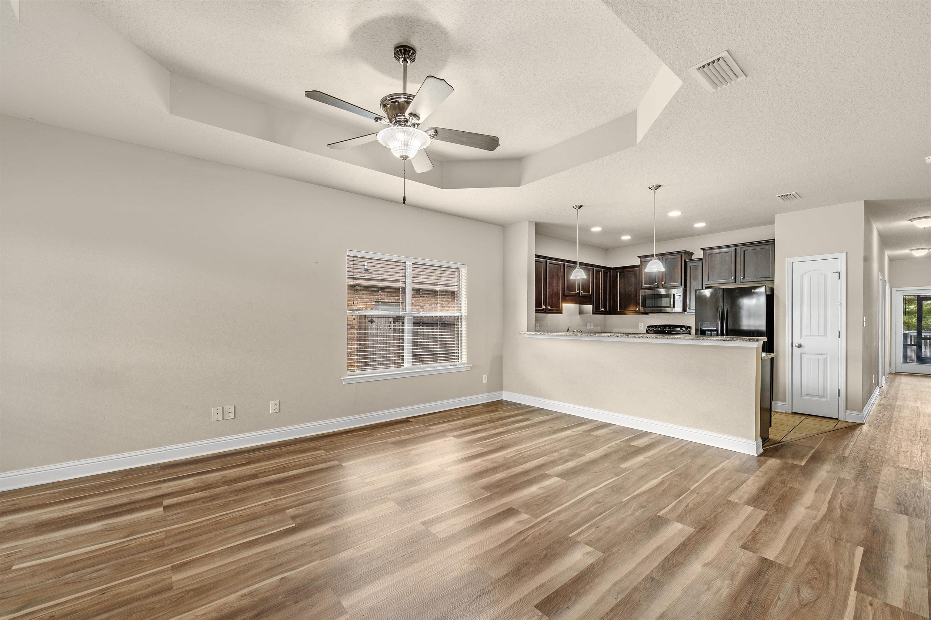 10421 Fionn Loop Daphne, AL 36526 - Photo 16 of 47 Living to kitchen