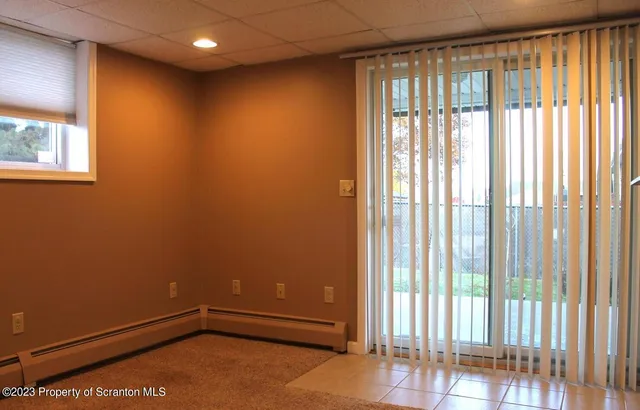 a view of a room with a large window