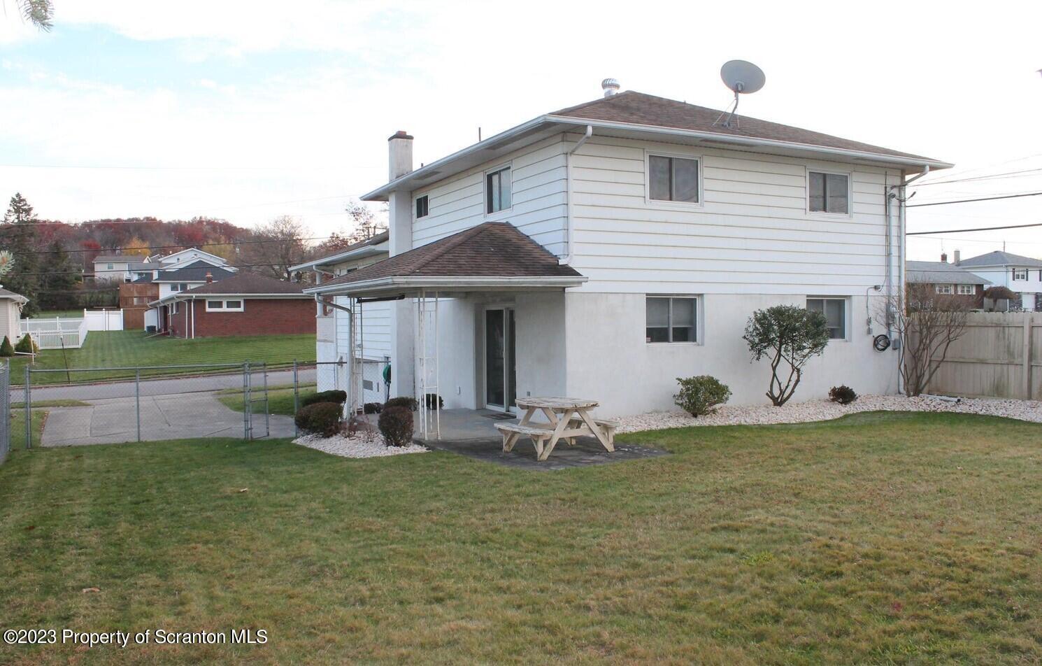 707 Hollenback Street Moosic, PA 18507 - Photo 15 of 20 a front view of a house with garden