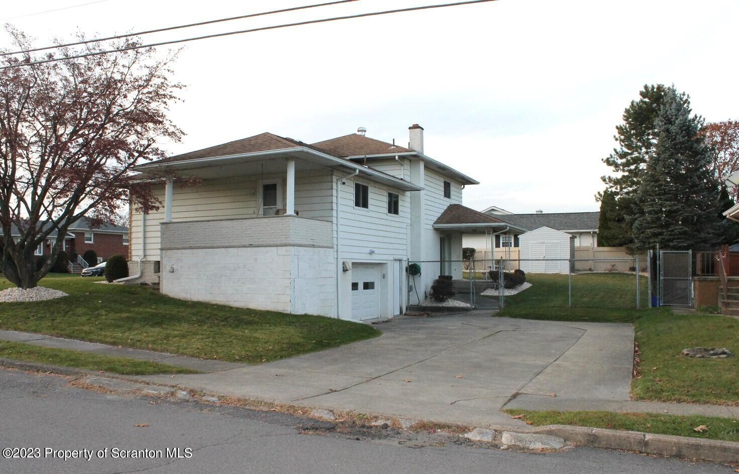 707 Hollenback Street Moosic, PA 18507 - Photo 19 of 20 a view of a house with a yard