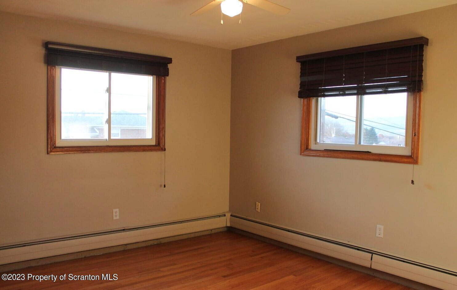 707 Hollenback Street Moosic, PA 18507 - Photo 8 of 20 an empty room with a window