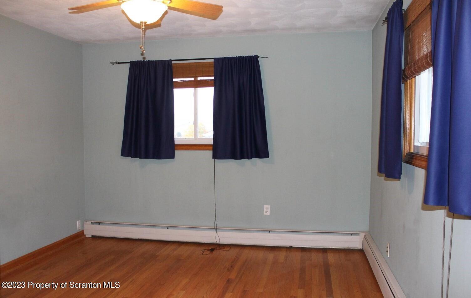 707 Hollenback Street Moosic, PA 18507 - Photo 9 of 20 a view of a small space with wooden floor and a window