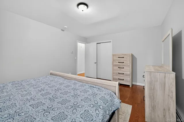 walk in closet with wooden floor