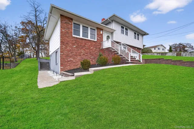 a front view of a house with garden