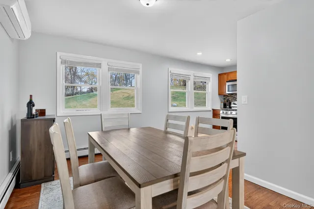 a dining room with furniture and window