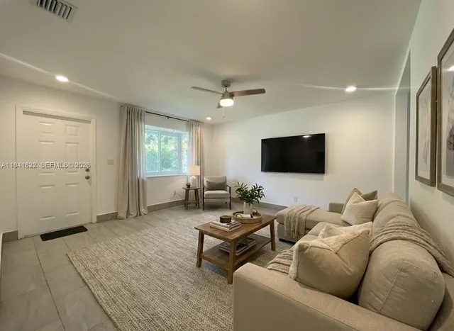 a kitchen with a sink and a stove top oven