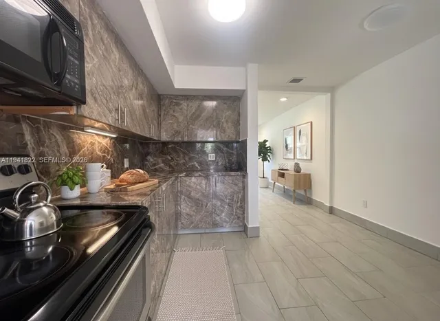 a spacious bedroom with a bed and furniture