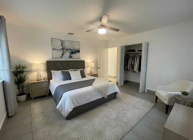 a bedroom with a bed and window