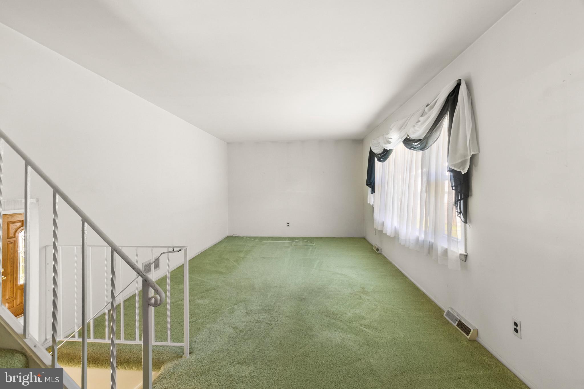 402 Blackstone Road Newark, DE 19713 - Photo 11 of 29 a view of a hallway with staircase