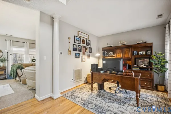 a view of a workspace with furniture and a livingroom