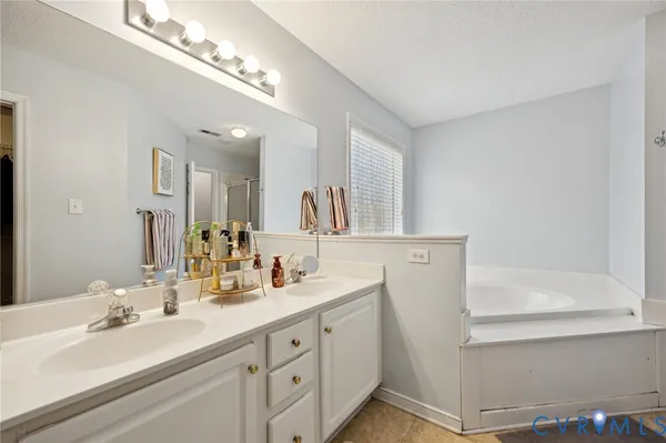 a bathroom with a sink and a tub