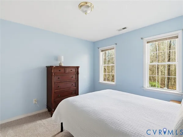 a bathroom with a sink a toilet and shower curtain