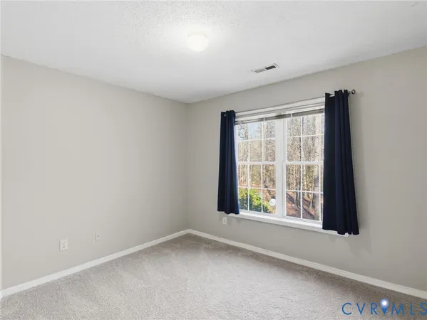 a bedroom with a bed and a shower