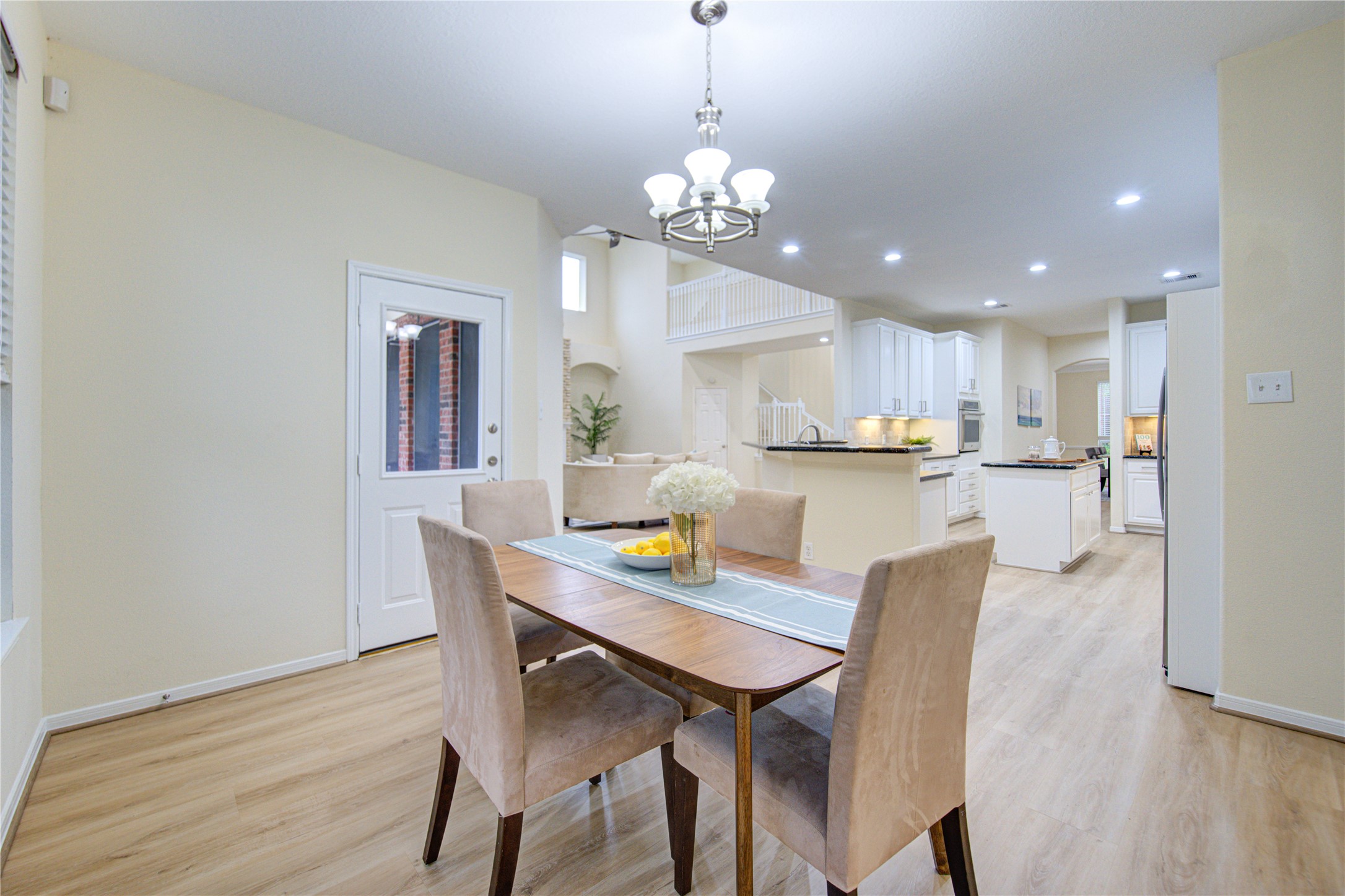 2327 Centerbrook Lane Katy, TX 77450 - Photo 20 of 47 a view of a dining room with furniture and wooden floor