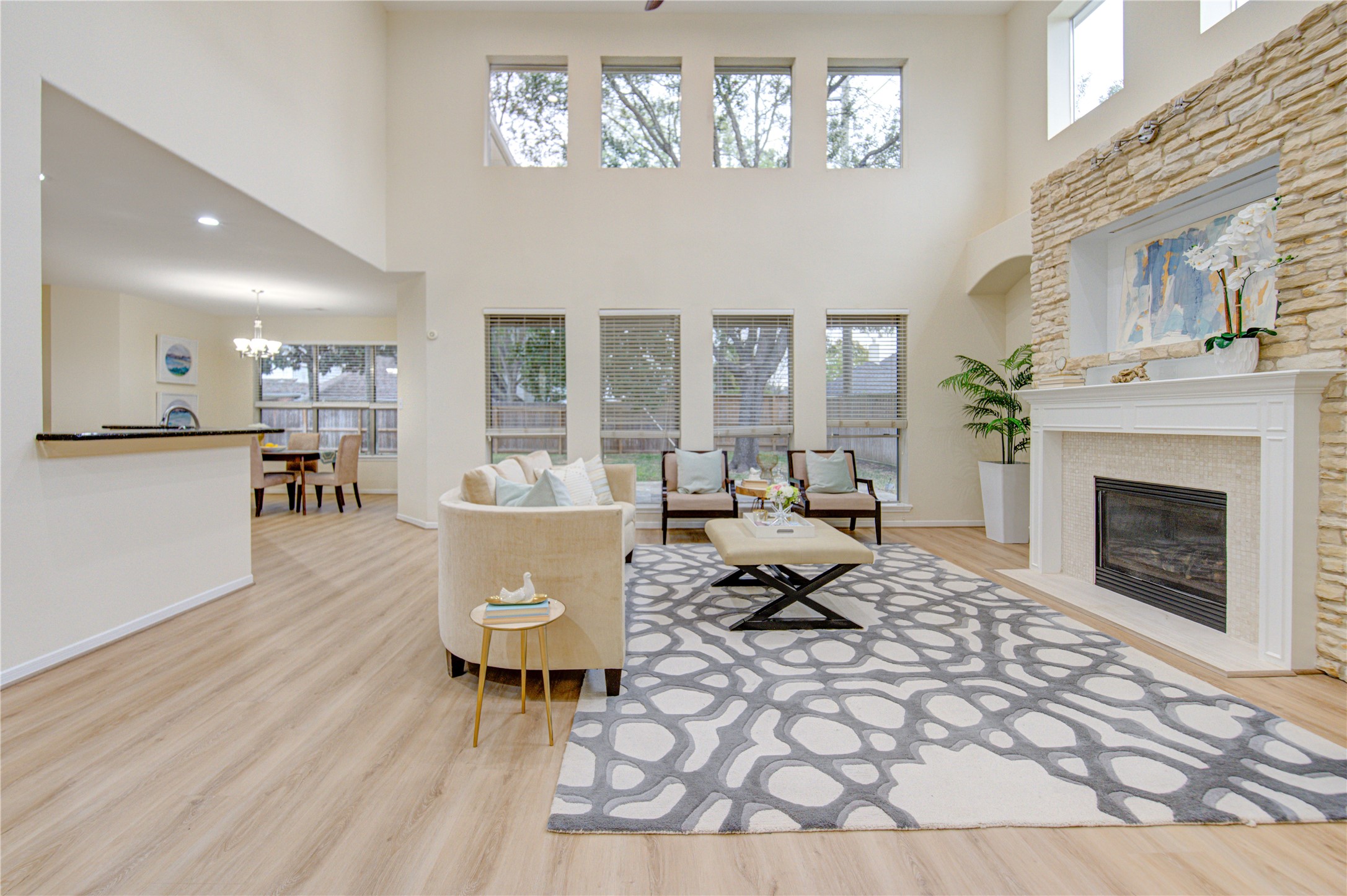 2327 Centerbrook Lane Katy, TX 77450 - Photo 23 of 47 a living room with furniture a dining table and a fireplace