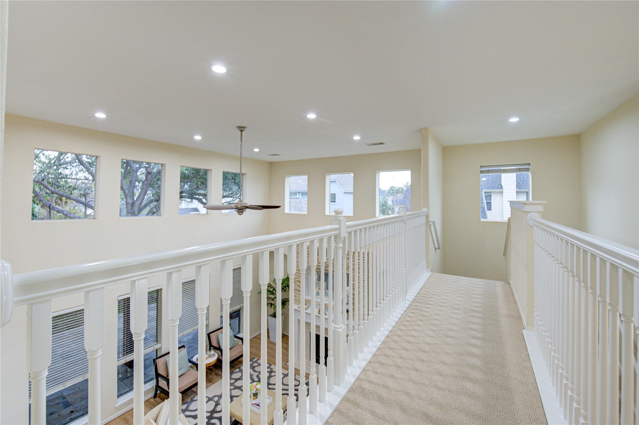 2327 Centerbrook Lane Katy, TX 77450 - Photo 29 of 47 a view of a hallway with wooden floor and windows