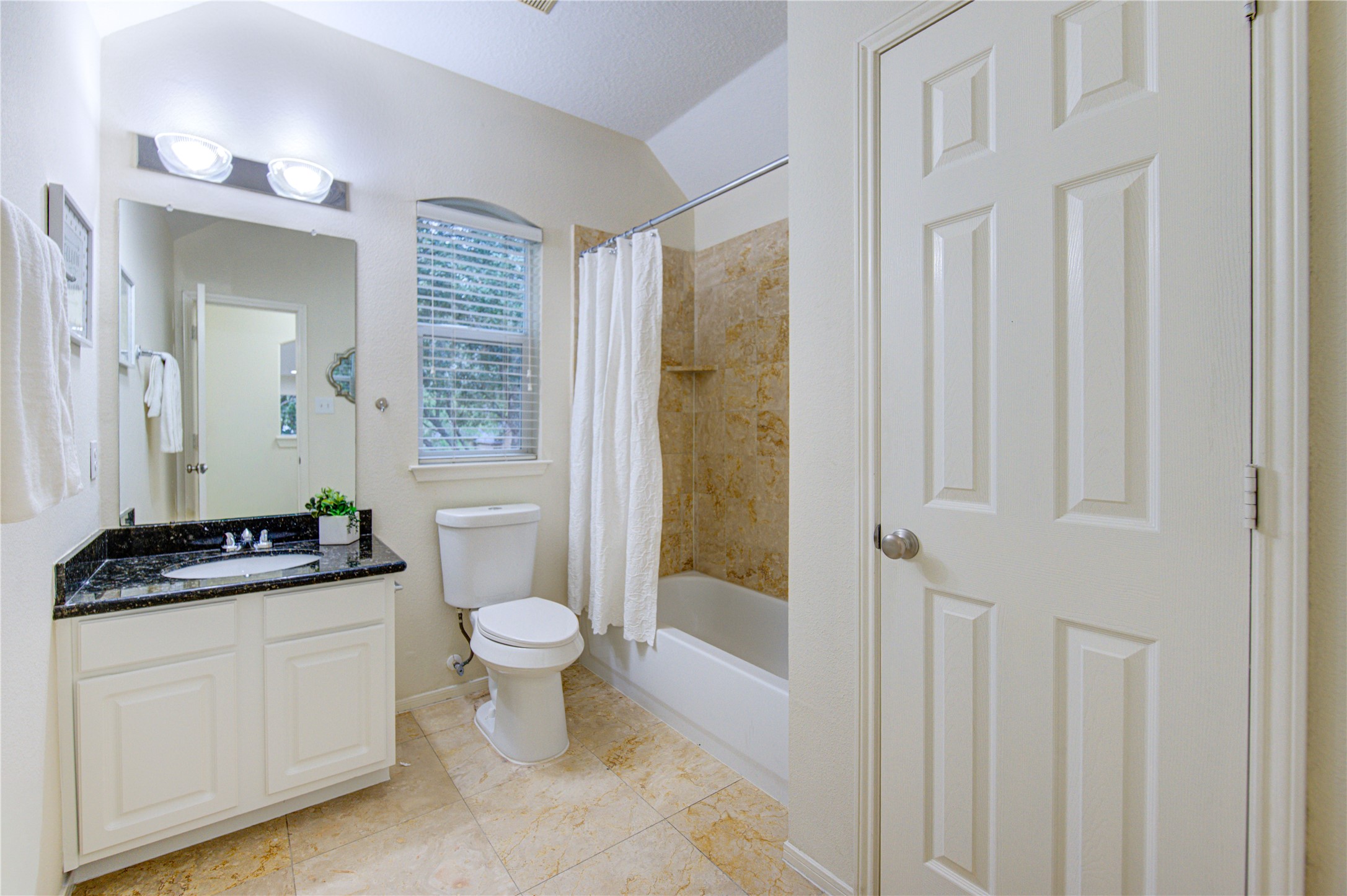 2327 Centerbrook Lane Katy, TX 77450 - Photo 31 of 47 a bathroom with a granite countertop toilet a sink and a mirror