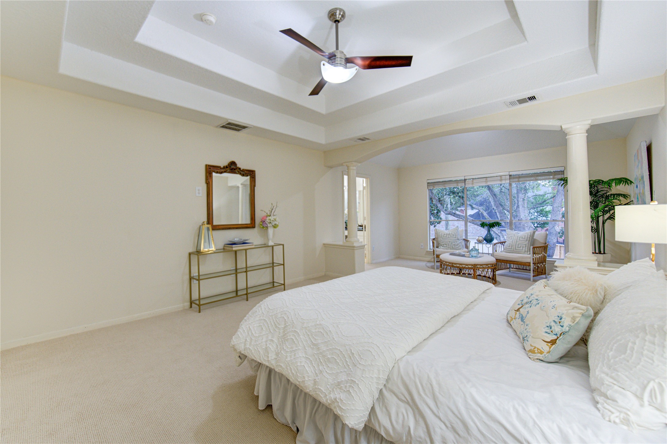 2327 Centerbrook Lane Katy, TX 77450 - Photo 35 of 47 a bedroom with a large bed and a chandelier