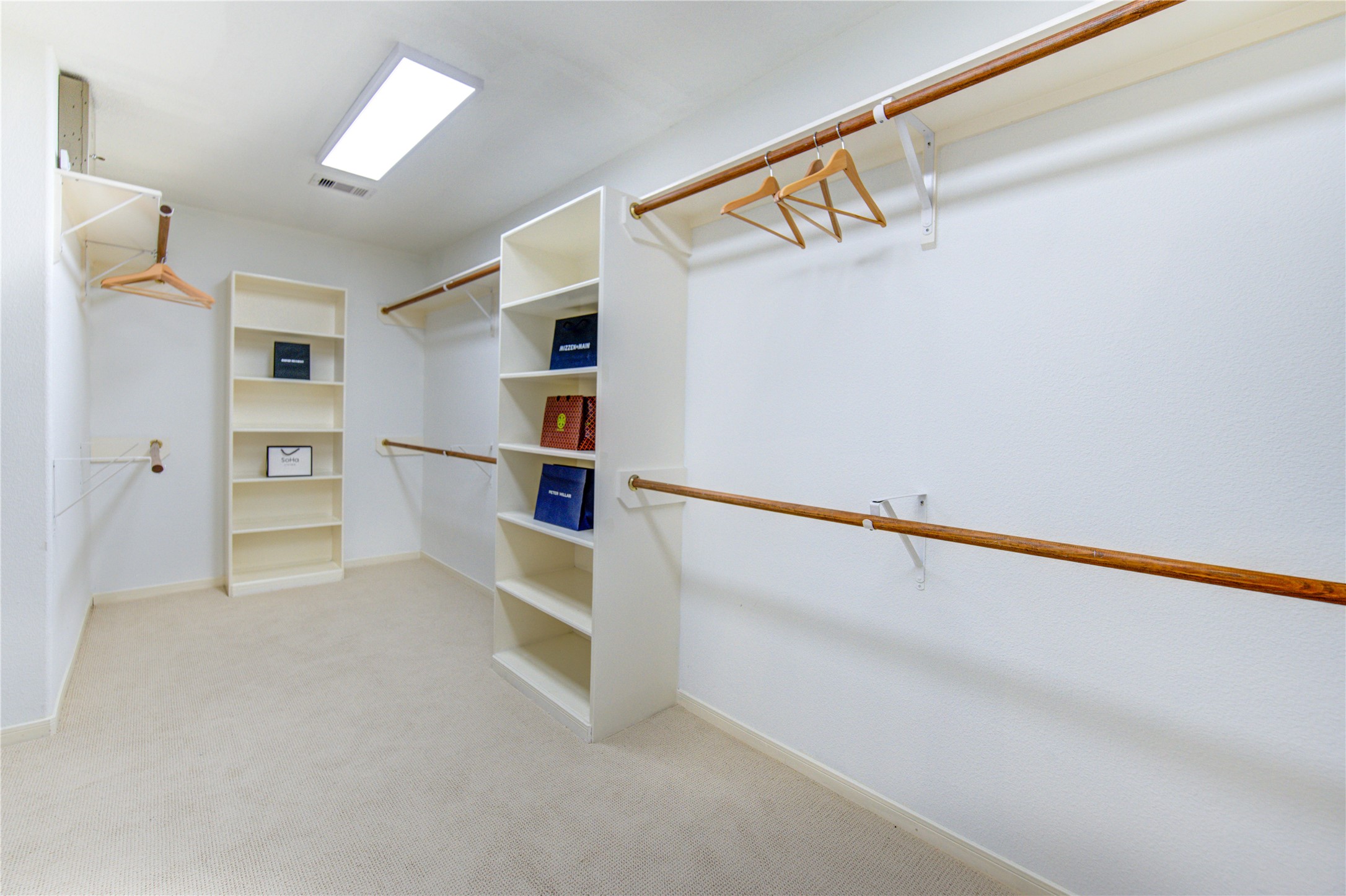 2327 Centerbrook Lane Katy, TX 77450 - Photo 40 of 47 a view of walk in closet with empty racks