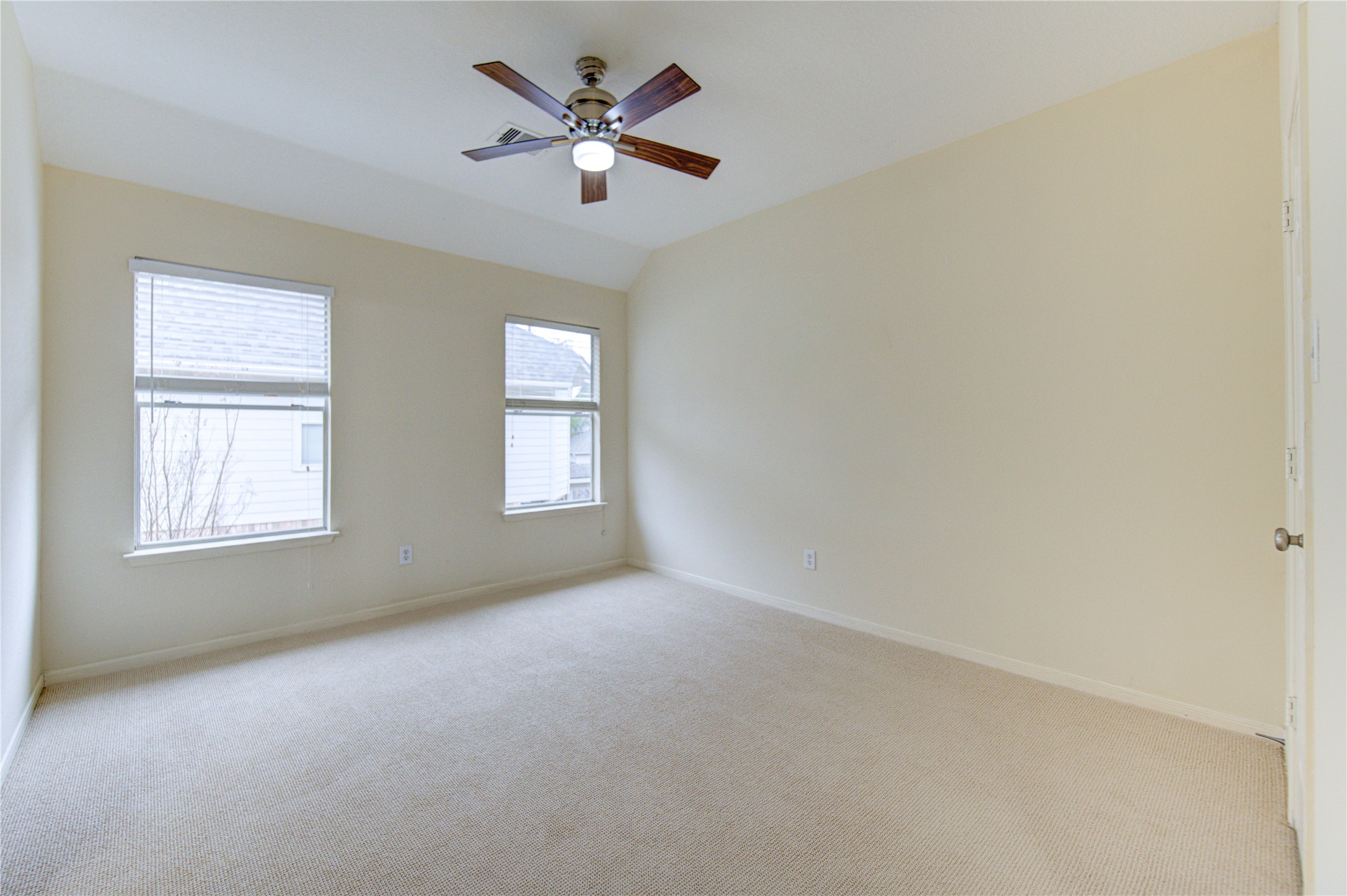 2327 Centerbrook Lane Katy, TX 77450 - Photo 42 of 47 an empty room with a window and a fan