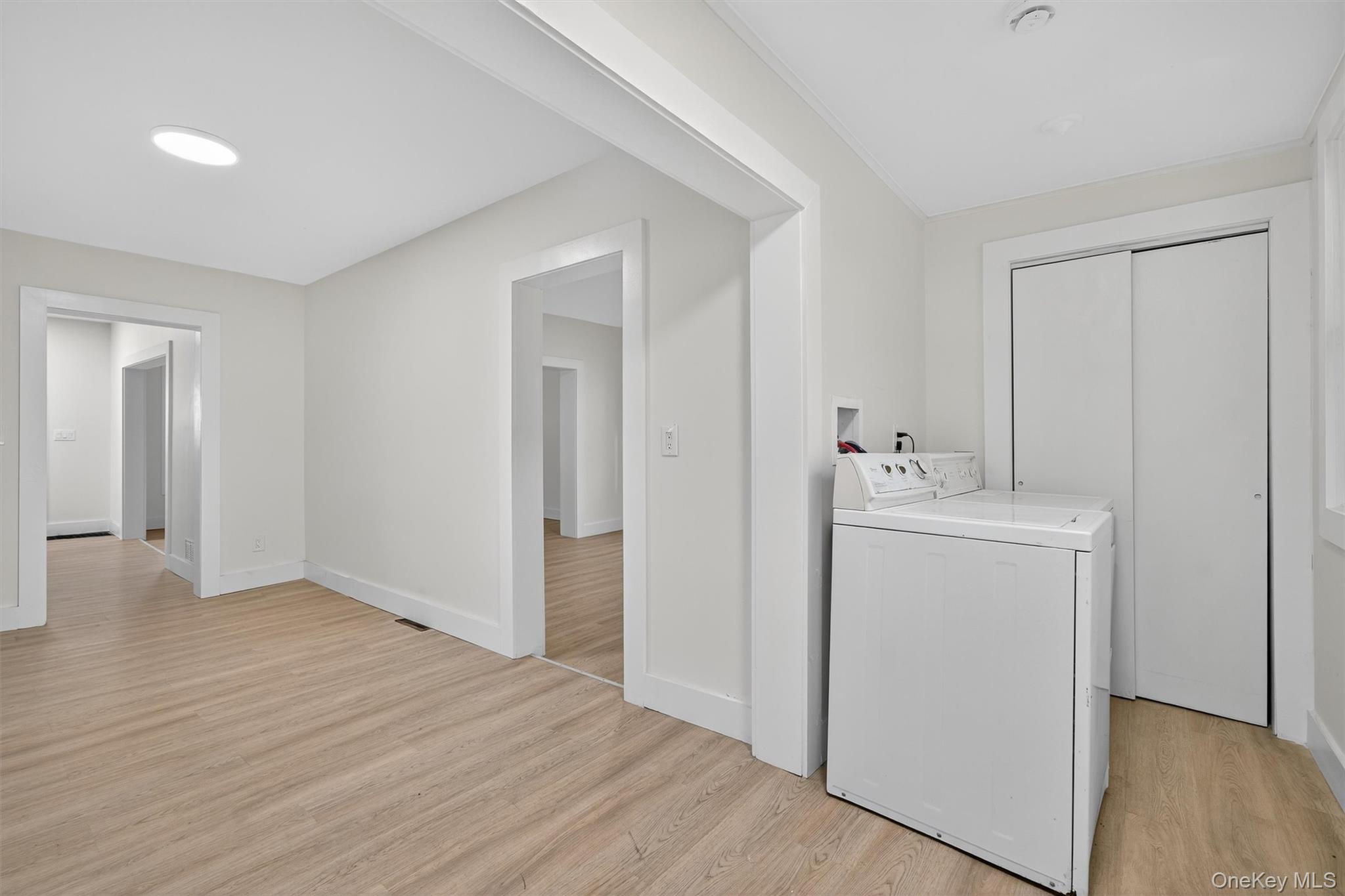 26 Ridge Street Middletown, NY 10940 - Photo 13 of 22 a utility room with cabinets washer and dryer
