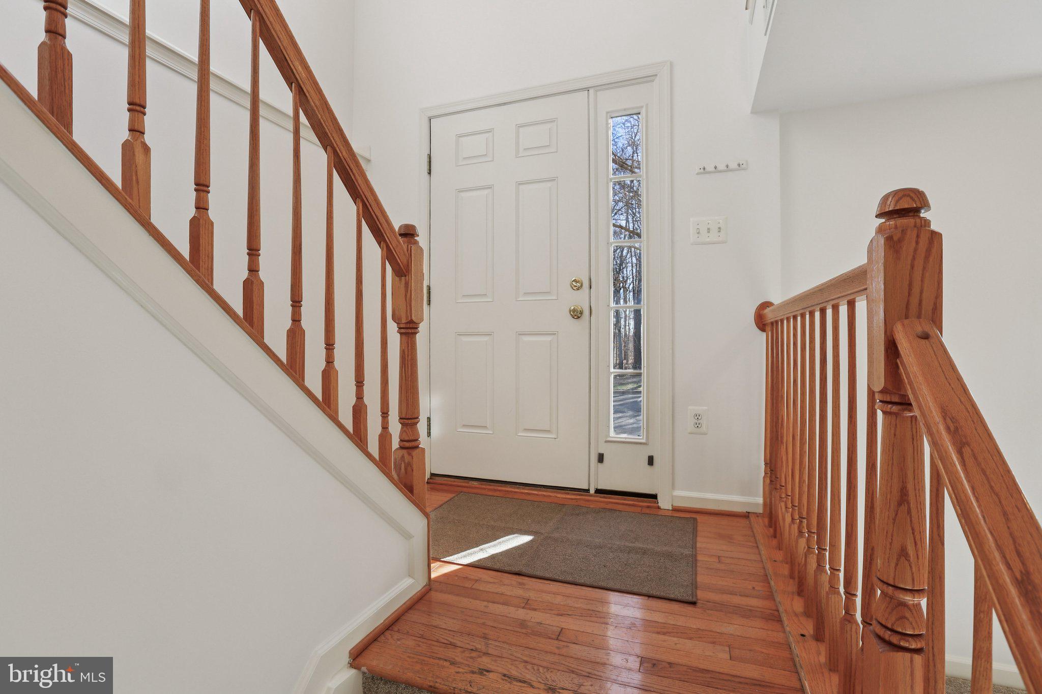 8046 Pennington Drive Laurel, MD 20724 - Photo 2 of 12 a view of an entryway with wooden floor