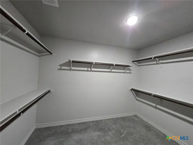 a view of a room with racks on the wall