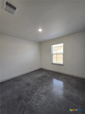 an empty room with windows