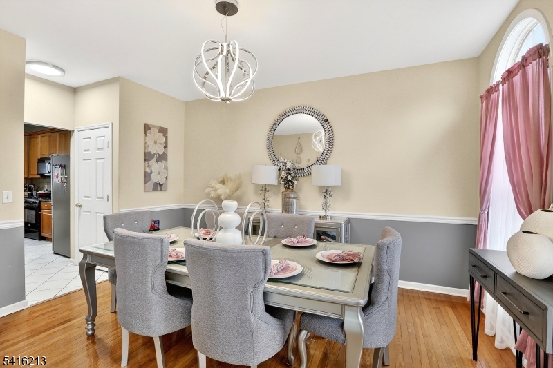 127 Churchill Avenue Somerset, NJ 08873 - Photo 11 of 33 a view of a dining room with furniture window and wooden floor