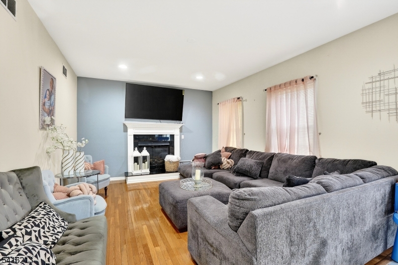 127 Churchill Avenue Somerset, NJ 08873 - Photo 14 of 33 a living room with furniture fireplace and a flat screen tv