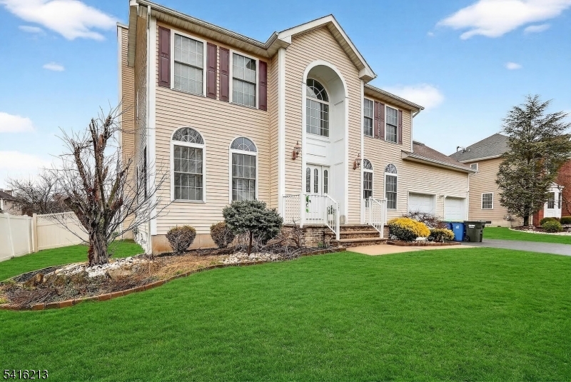127 Churchill Avenue Somerset, NJ 08873 - Photo 2 of 33 a front view of a house with garden and yard