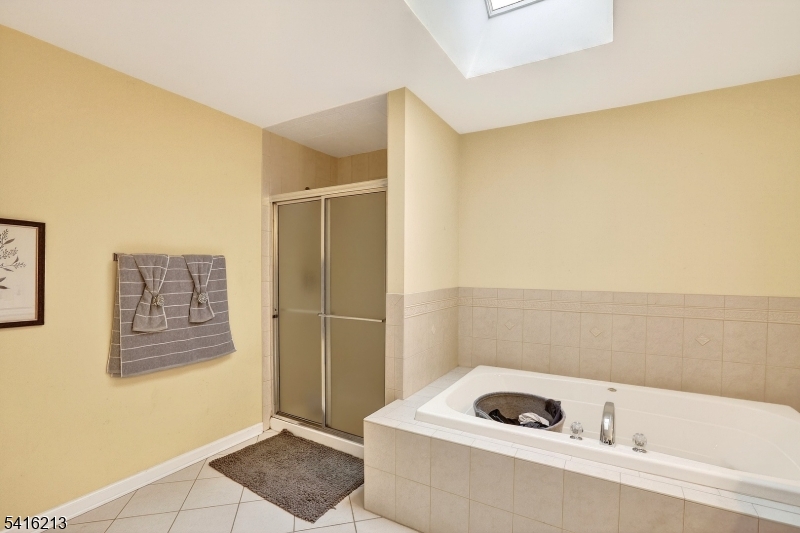 127 Churchill Avenue Somerset, NJ 08873 - Photo 23 of 33 a bathroom with a bathtub and shower
