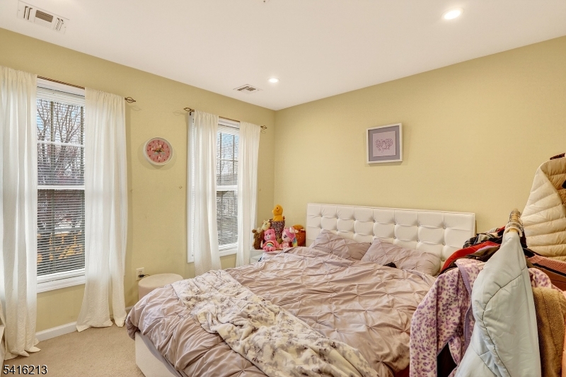 127 Churchill Avenue Somerset, NJ 08873 - Photo 29 of 33 a bedroom with a bed and a window