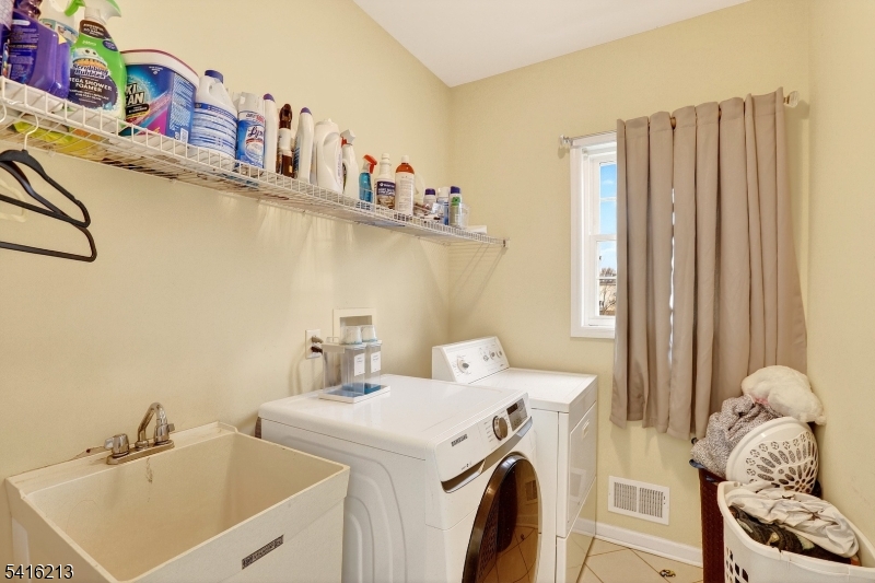 127 Churchill Avenue Somerset, NJ 08873 - Photo 32 of 33 a utility room with dryer and washer