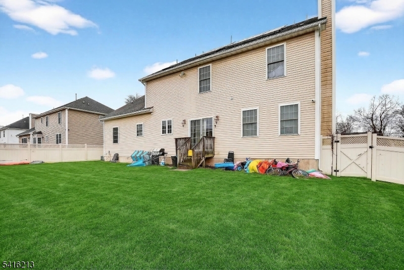127 Churchill Avenue Somerset, NJ 08873 - Photo 6 of 33 a view of a house with a backyard