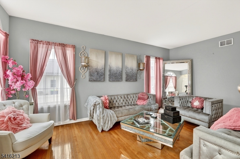 127 Churchill Avenue Somerset, NJ 08873 - Photo 7 of 33 a living room with furniture and a large window