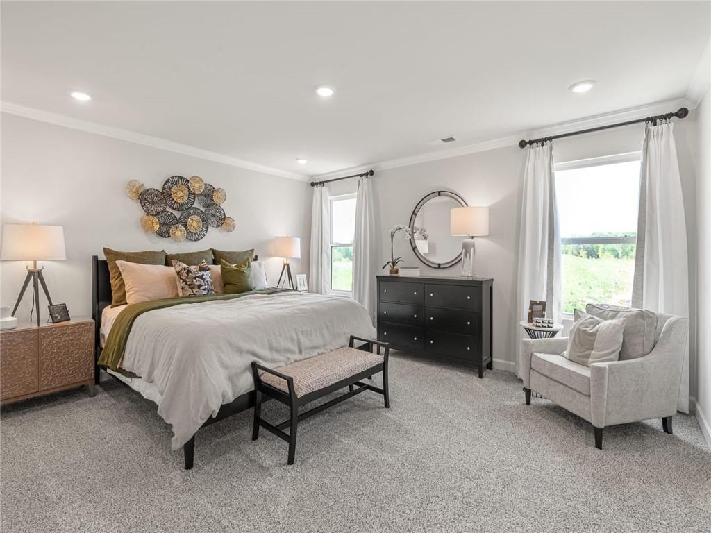 1478 High Fls Lane Grayson, GA 30017 - Photo 9 of 15 a spacious bedroom with a bed and a couch