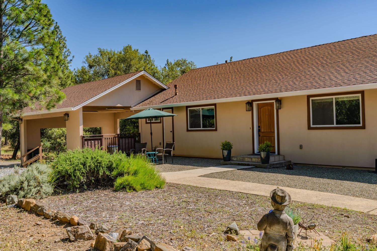 18299 West Clinton Road Jackson, CA 95642 - Photo 11 of 56 a front view of a house with a yard