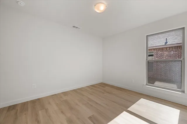 a view of an empty walk in closet