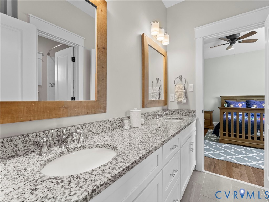 1925 Limbeck Lane Midlothian, VA 23112 - Photo 50 of 89 a bathroom with a granite countertop sink double and mirror