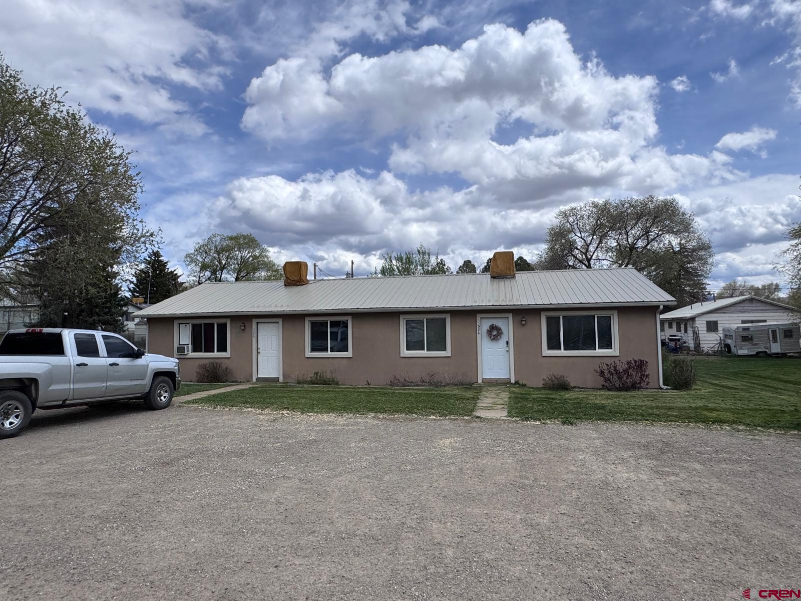 512 East Fourth Street Cortez, CO 81321 - Photo 1 of 4 front view of house with a yard