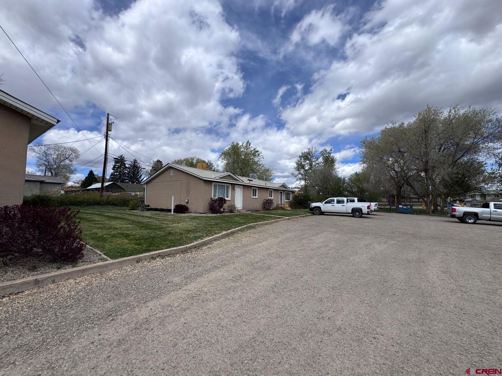 512 East Fourth Street Cortez, CO 81321 - Photo 3 of 4 a front view of a house with a yard and garage