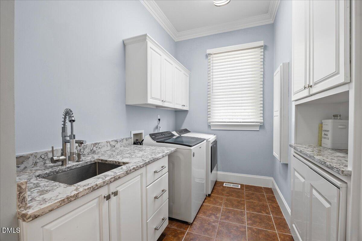 1504 Consett Court Raleigh, NC 27613 - Photo 37 of 81 Laundry room with sink- main level