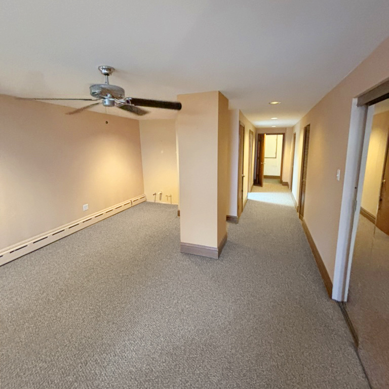 2133 West Grace Street, Unit 2 Chicago, IL 60618 - Photo 11 of 22 a view of a livingroom with wooden floor and a ceiling fan