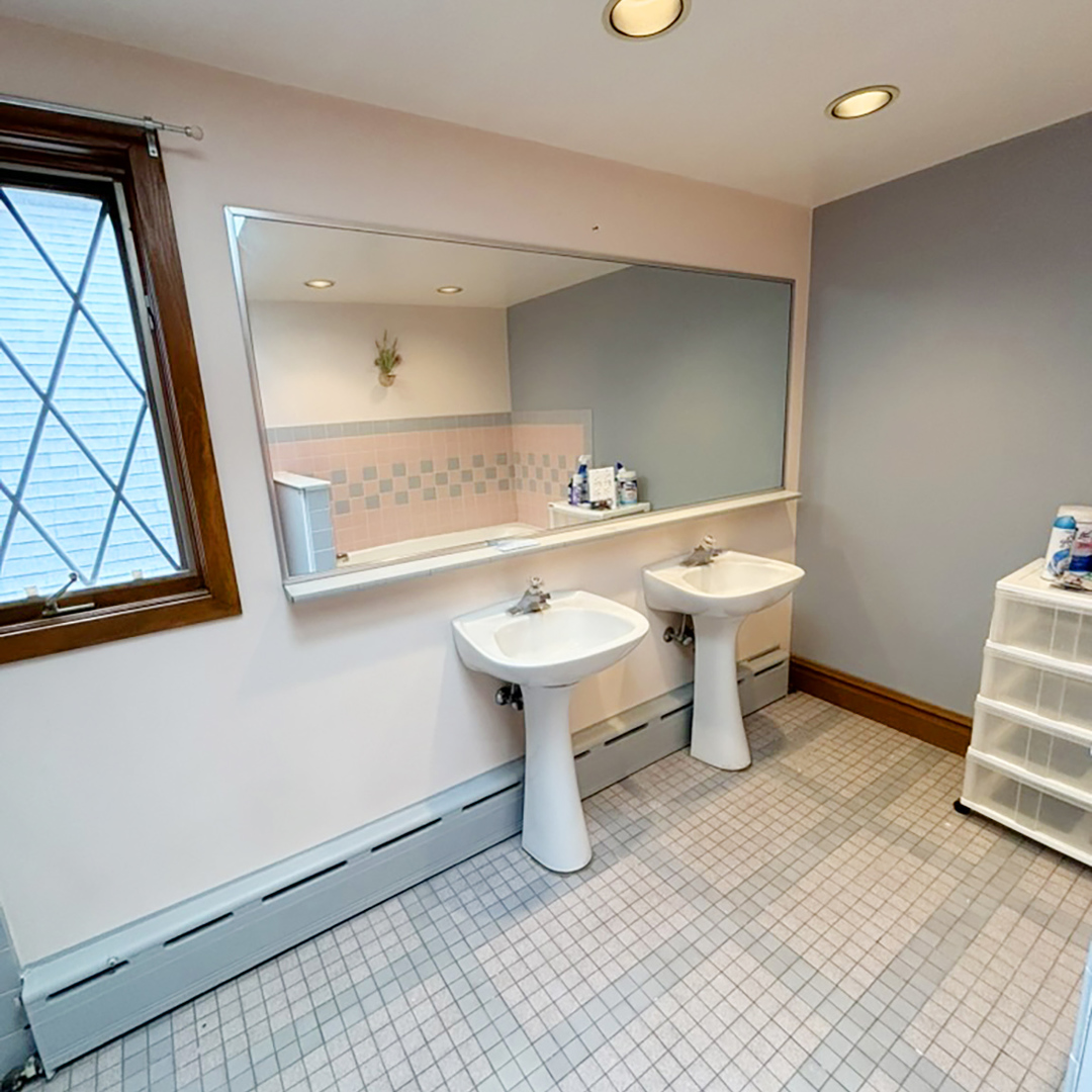 2133 West Grace Street, Unit 2 Chicago, IL 60618 - Photo 14 of 22 a bathroom with a sink and a mirror