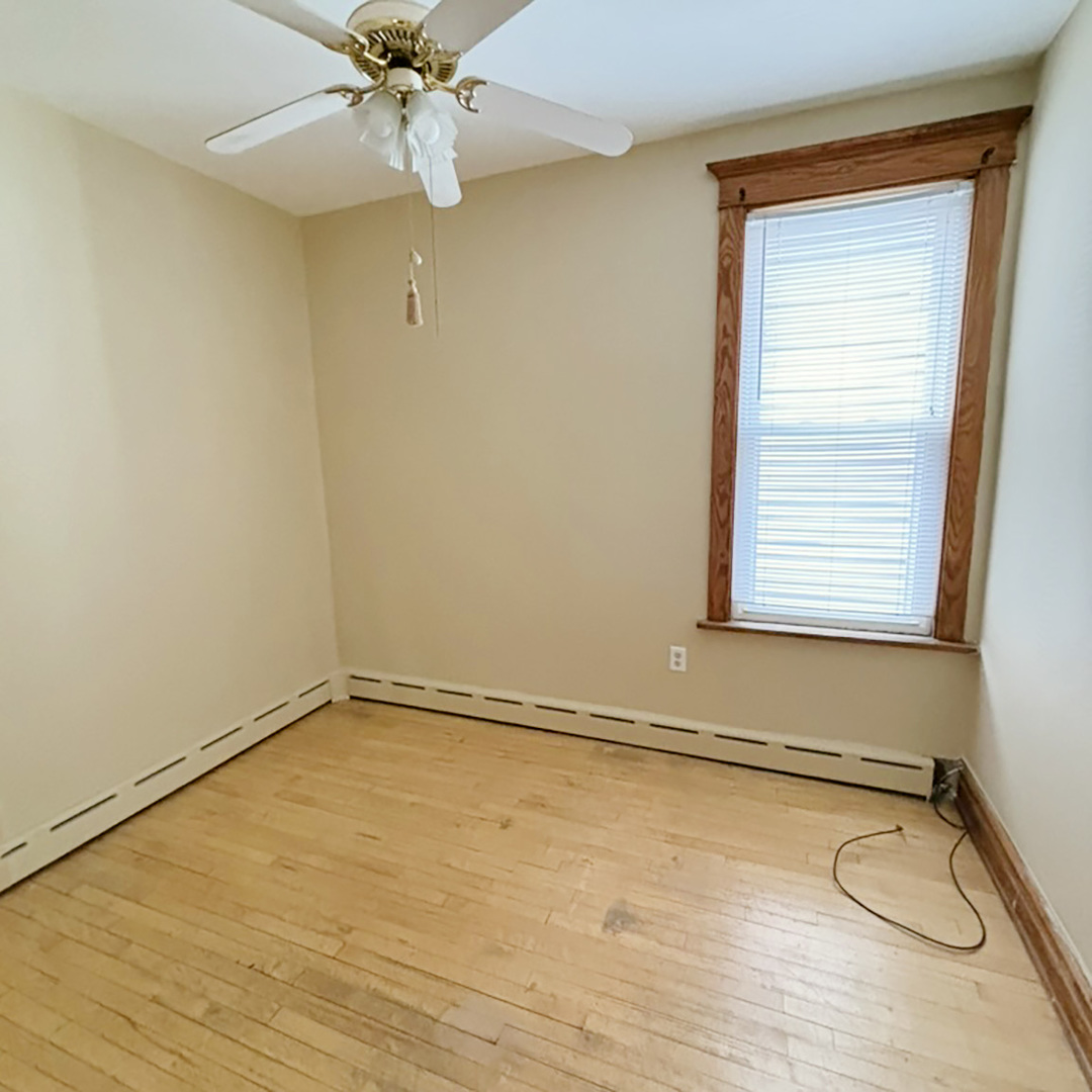 2133 West Grace Street, Unit 2 Chicago, IL 60618 - Photo 17 of 22 a room with window and ceiling fan