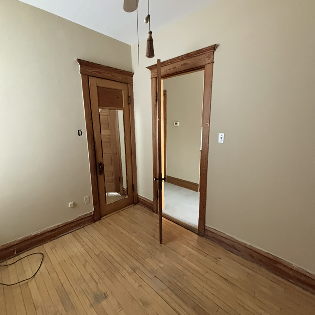 2133 West Grace Street, Unit 2 Chicago, IL 60618 - Photo 18 of 22 a view of a room with wooden floor and a window