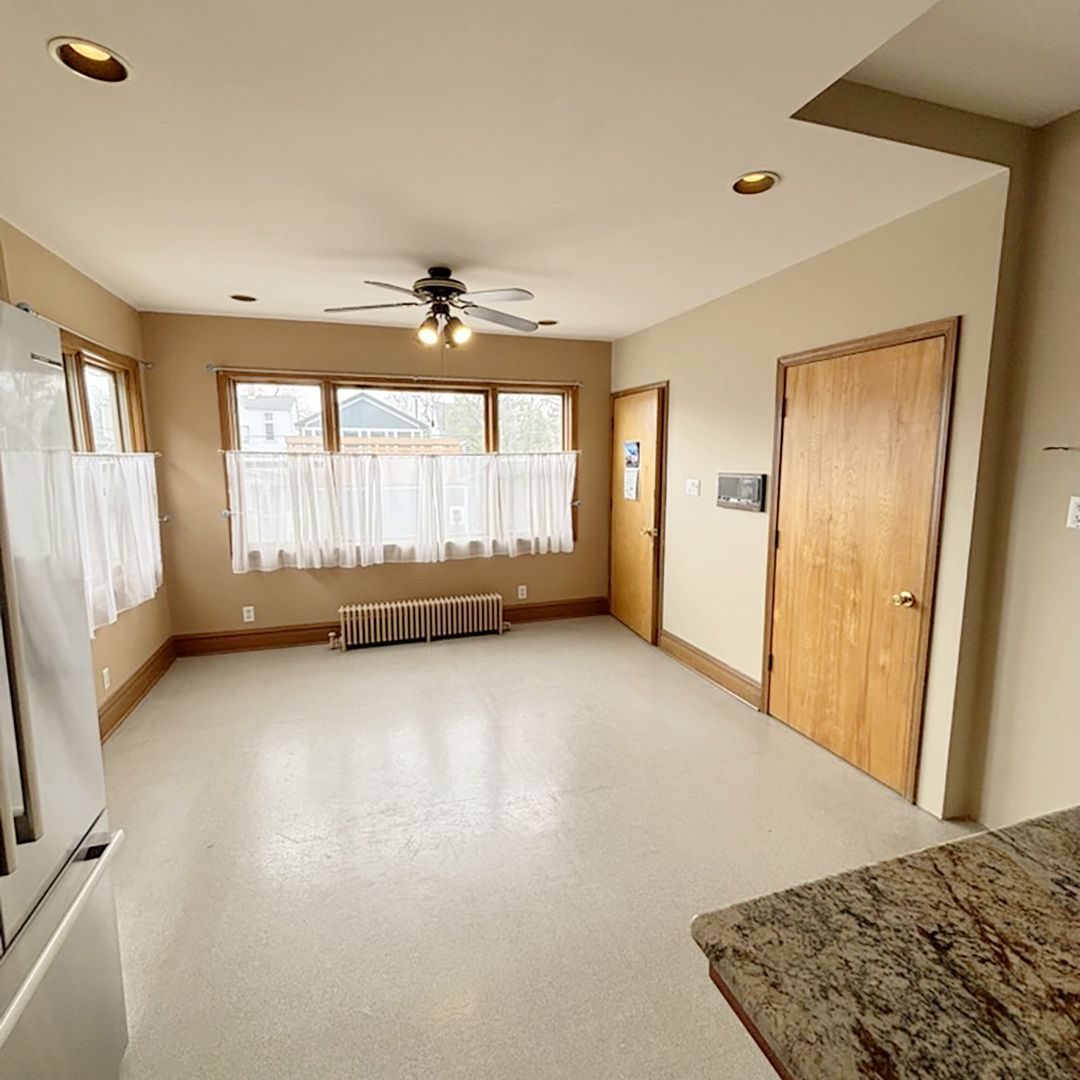 2133 West Grace Street, Unit 2 Chicago, IL 60618 - Photo 4 of 22 a view of an empty room with a window