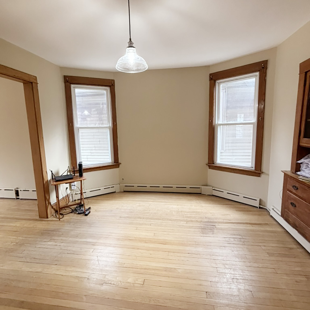 2133 West Grace Street, Unit 2 Chicago, IL 60618 - Photo 6 of 22 a view of a room with gym equipment and a large window