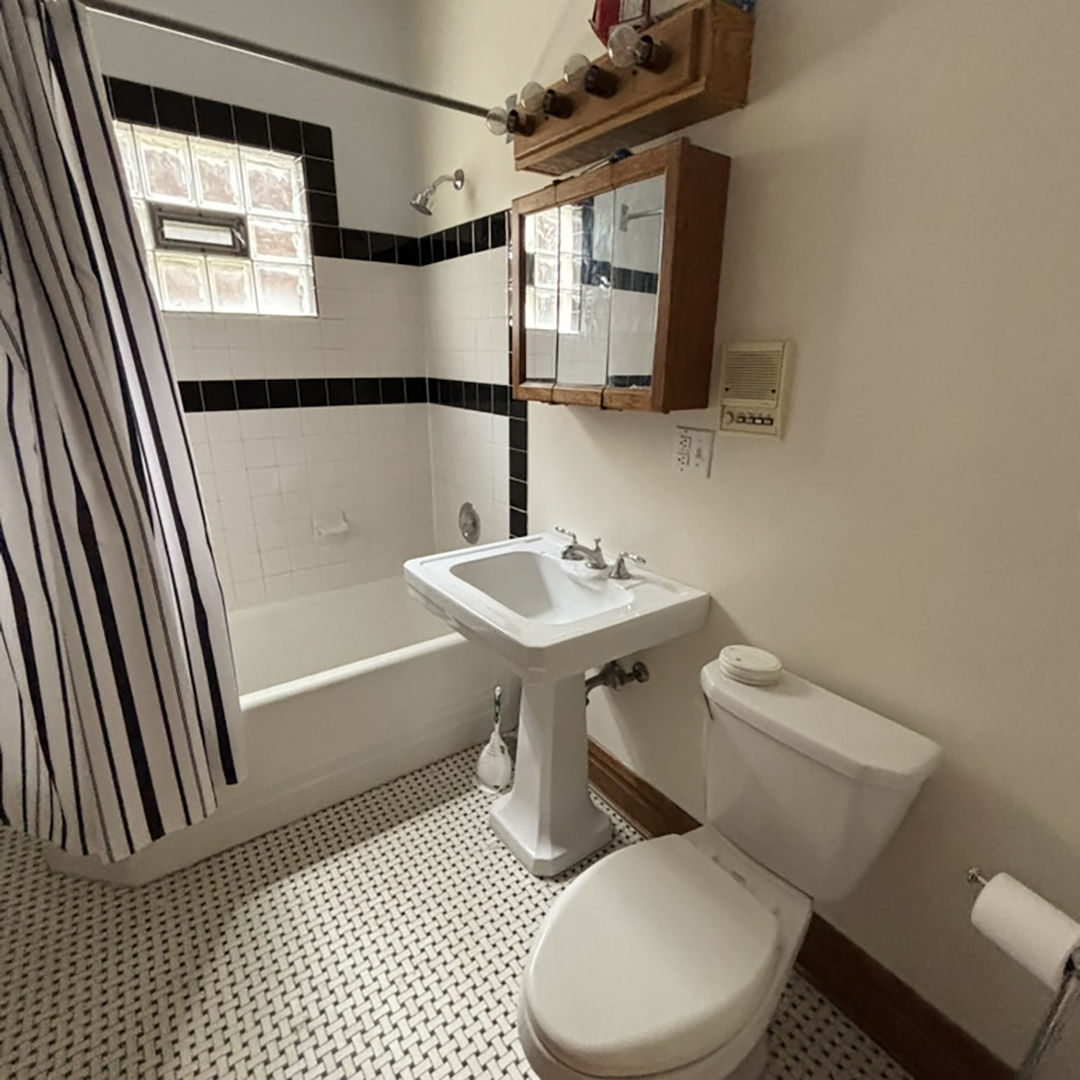 2133 West Grace Street, Unit 2 Chicago, IL 60618 - Photo 8 of 22 a bathroom with a sink toilet and shower